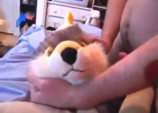 Dude's hard penis is used for plushie pleasure